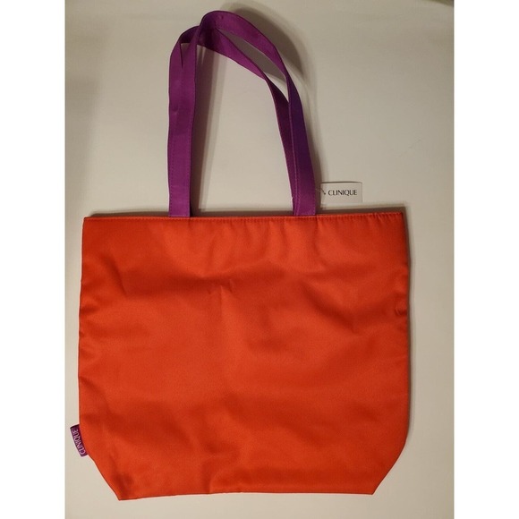 Clinique Handbags - Clinique Tote Bag Orange Purple Handle